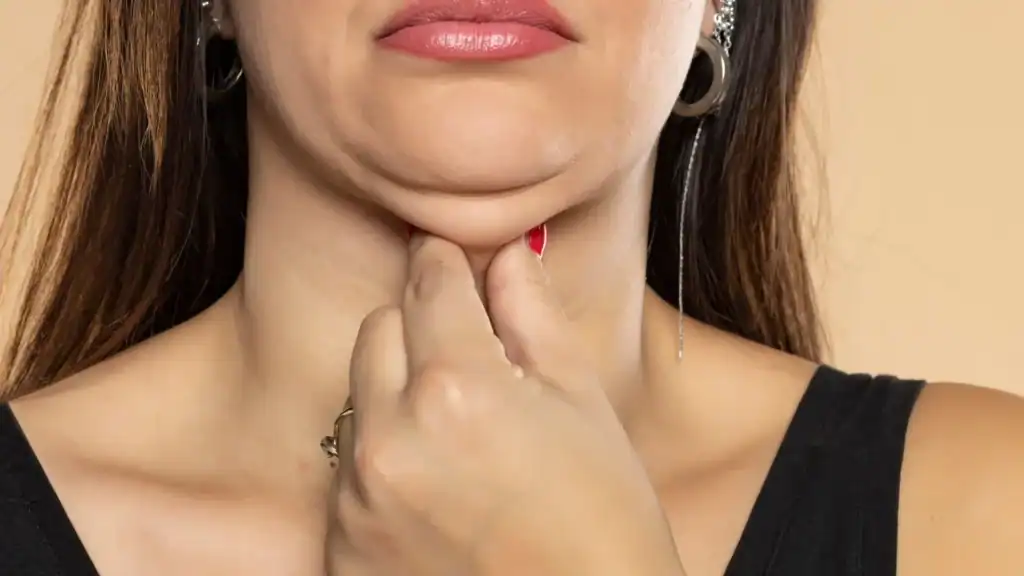 An image of a woman with double chin, sad, worried : Non Surgical Double Chin Removal Treatment in Drumbrae, UK